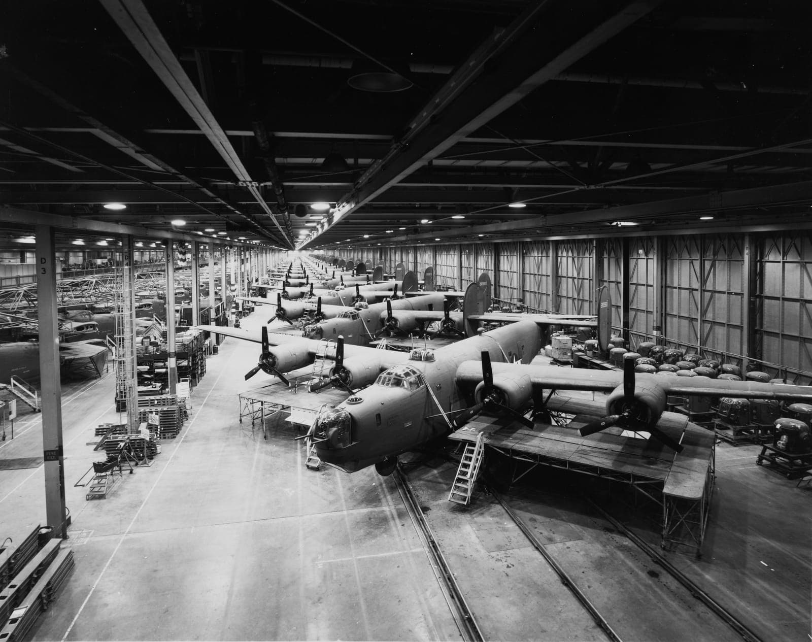 Rows of B-24 bombers on a wartime assembly line, 1944